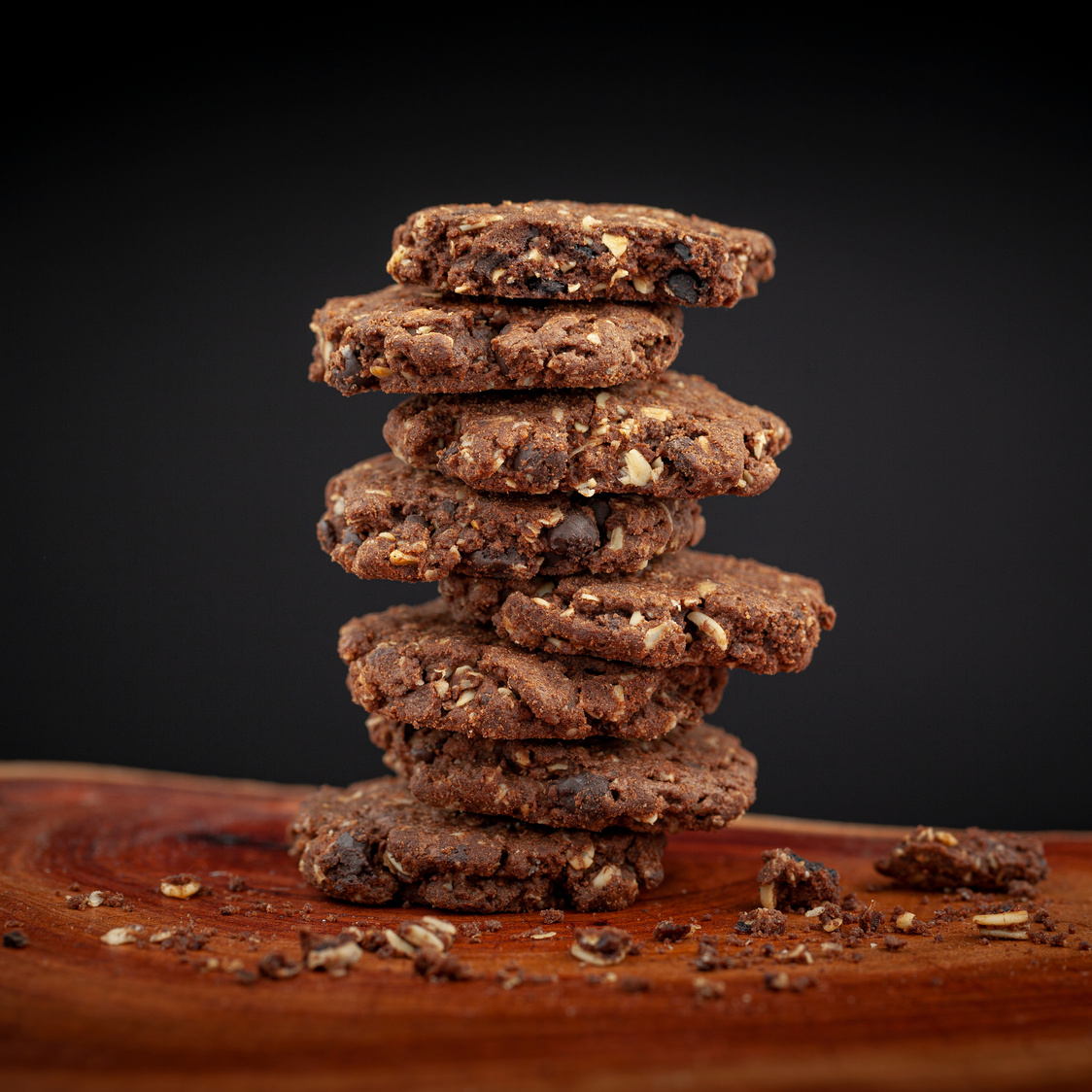 Stack of Chocolate Chip and Oakmeal Cookies on Natural Wood Text